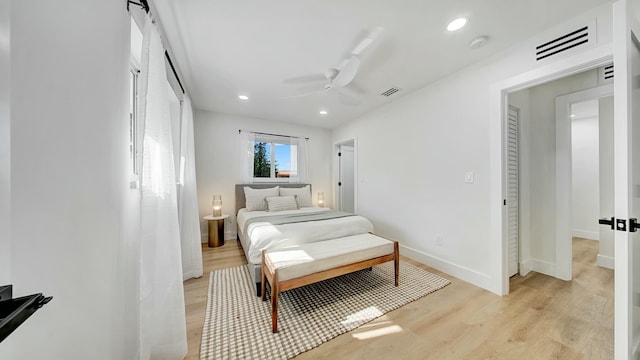 bedroom featuring ceiling fan and light hardwood / wood-style flooring