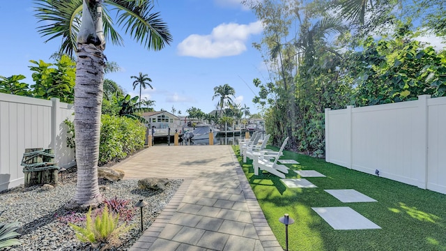 view of yard featuring a dock