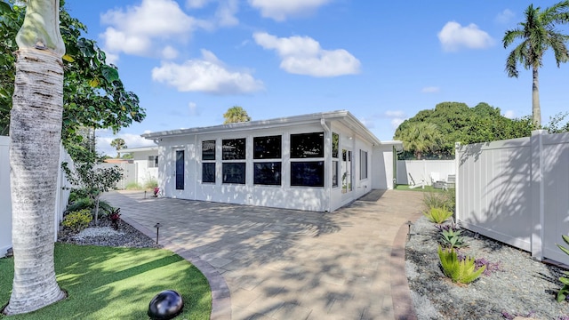 back of house with a patio