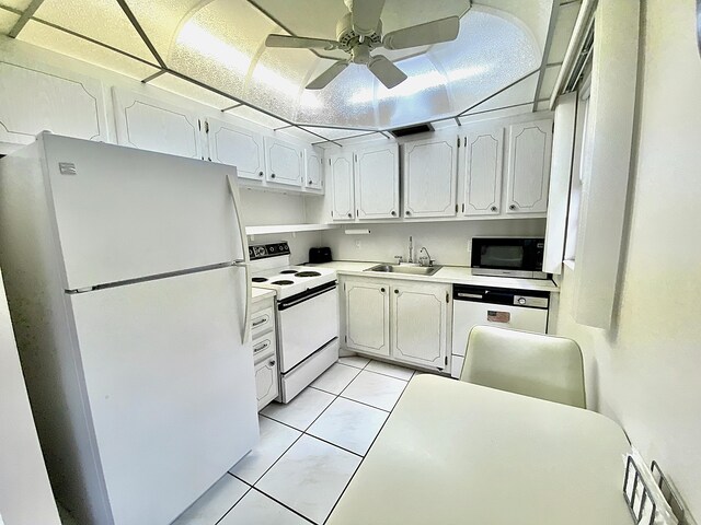 kitchen with ceiling fan, sink, white cabinets, white appliances, and light tile patterned floors