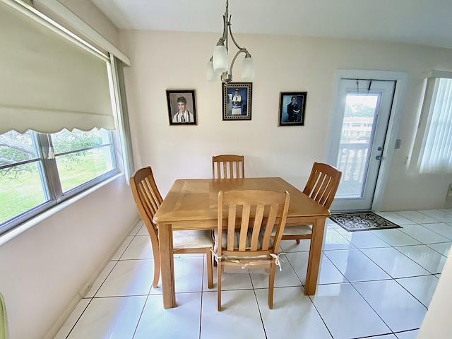 dining space featuring light tile patterned floors and a healthy amount of sunlight