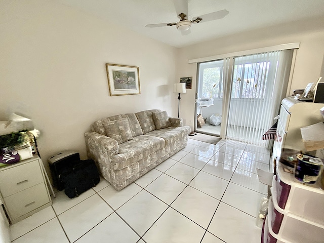 tiled living room with ceiling fan