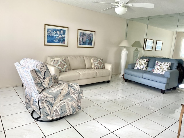 living room with light tile patterned floors, a textured ceiling, and ceiling fan