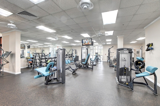 gym with a wealth of natural light and a drop ceiling