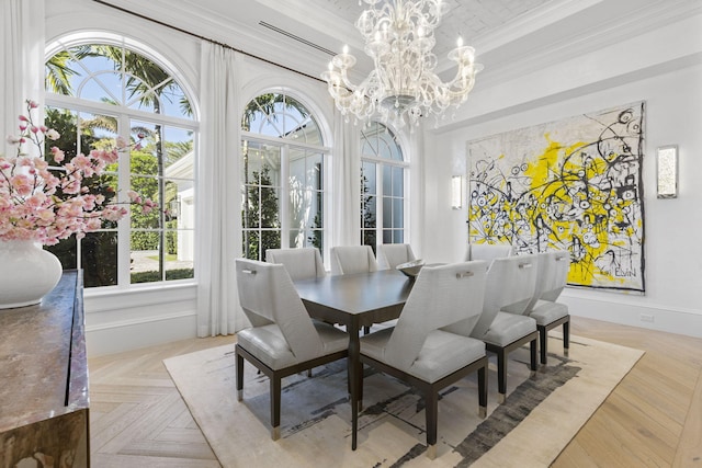 dining room featuring a healthy amount of sunlight, light parquet floors, ornamental molding, and a notable chandelier