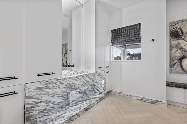 bathroom featuring parquet flooring