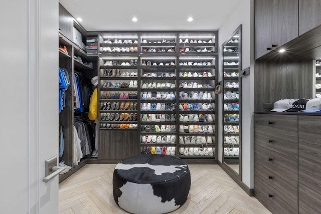 spacious closet with light parquet floors