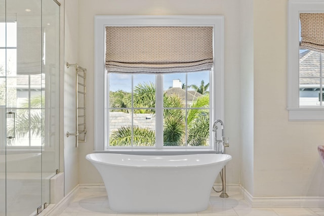 bathroom featuring separate shower and tub