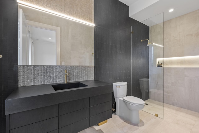 bathroom featuring tile patterned floors, a shower, toilet, decorative backsplash, and tile walls