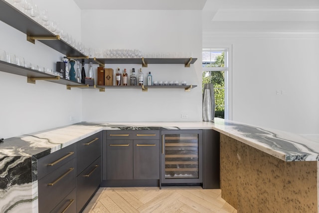 bar featuring beverage cooler and light parquet flooring