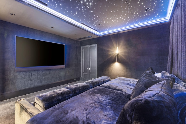 cinema room with a tray ceiling