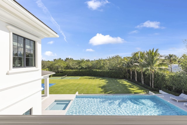 view of pool featuring a yard