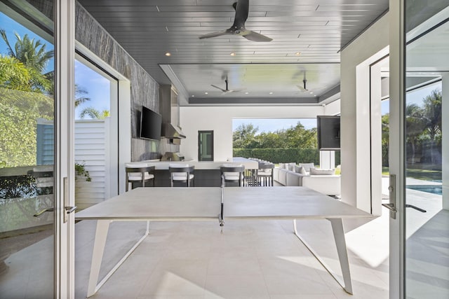 interior space featuring french doors, ceiling fan, and wooden ceiling