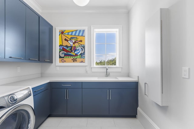 clothes washing area featuring cabinets, crown molding, sink, washer / dryer, and light tile patterned flooring