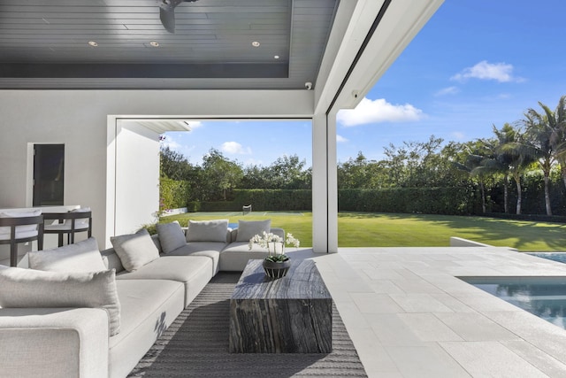 view of patio / terrace featuring a fenced in pool and an outdoor hangout area