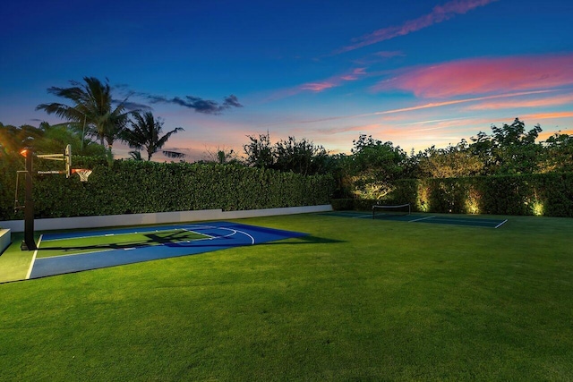 view of basketball court featuring a lawn