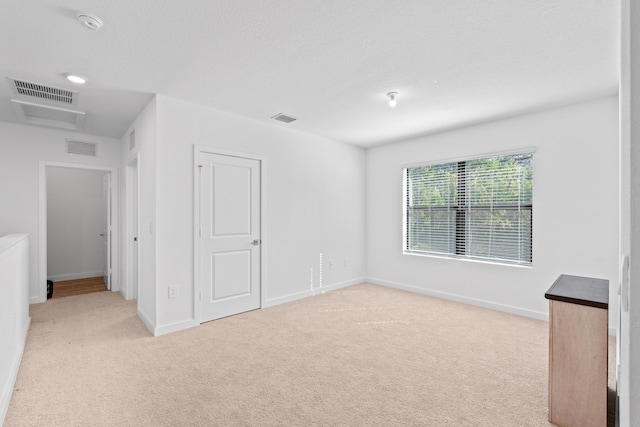 unfurnished bedroom with light carpet