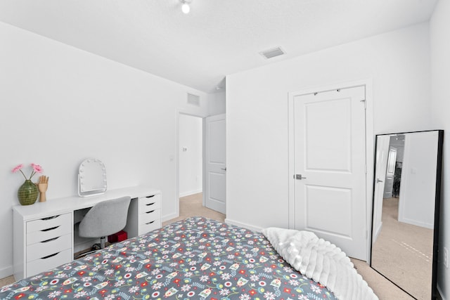 bedroom featuring light carpet