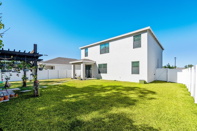 rear view of property with a lawn and a pergola