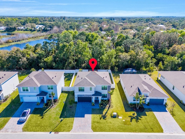 birds eye view of property with a water view