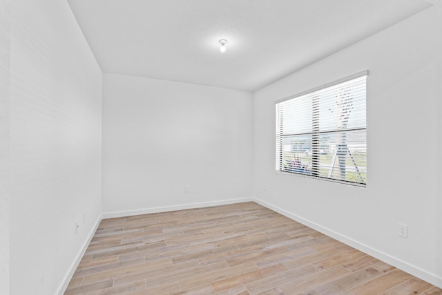 empty room with light wood-type flooring