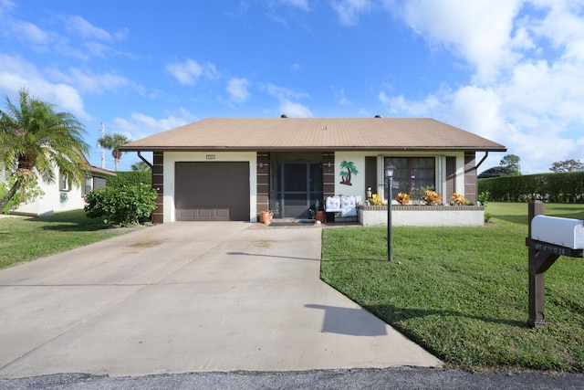 ranch-style house with a garage and a front lawn