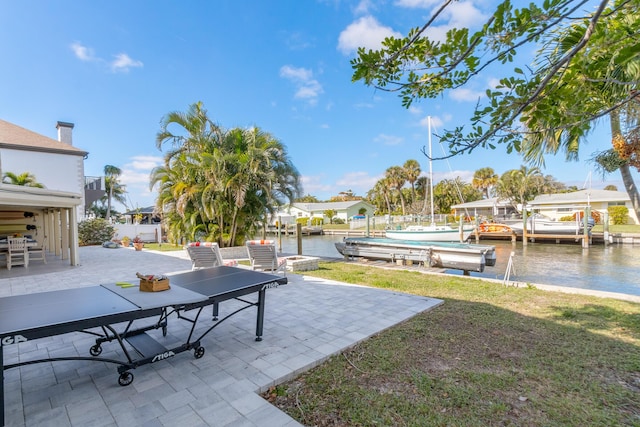 exterior space with a dock and a water view