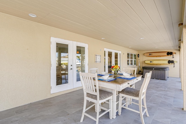 view of patio featuring a hot tub and french doors