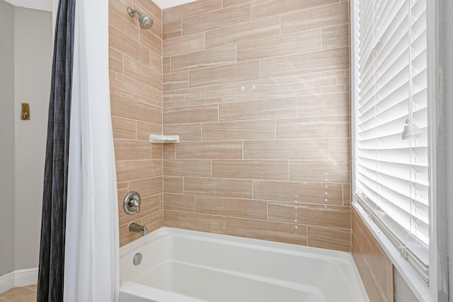 bathroom featuring shower / tub combo