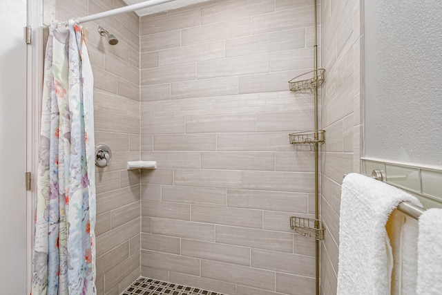 bathroom featuring curtained shower