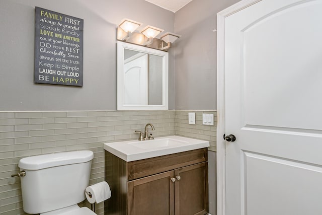 bathroom with toilet and vanity