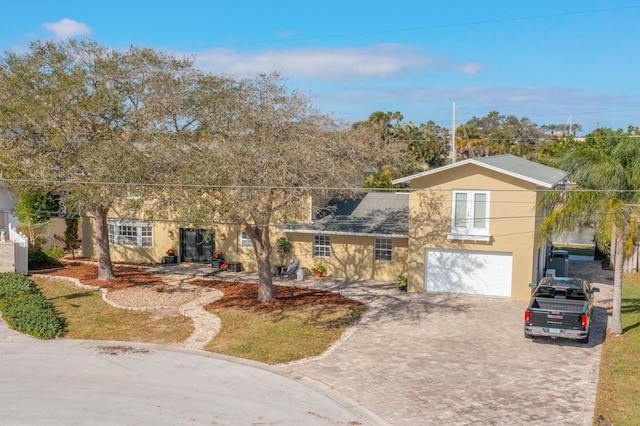 view of front of house with a garage