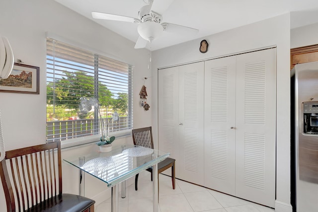 interior space featuring ceiling fan and light tile patterned floors