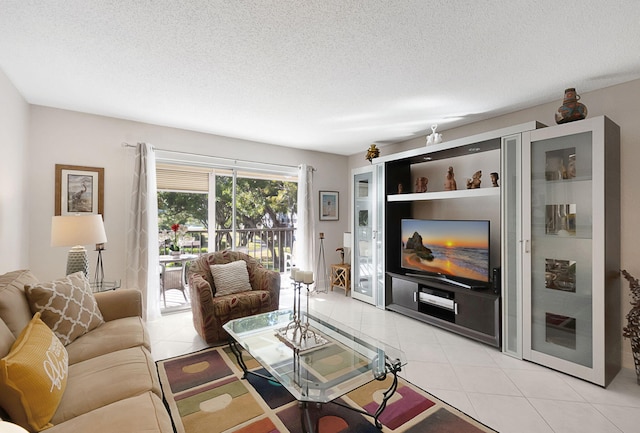 tiled living room featuring a textured ceiling