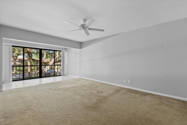 carpeted empty room with ceiling fan