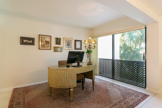 home office featuring light tile patterned floors and a notable chandelier