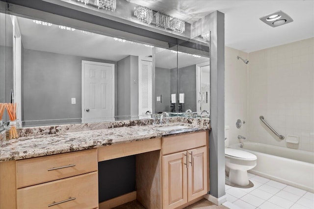 full bathroom featuring tiled shower / bath combo, vanity, tile patterned flooring, and toilet