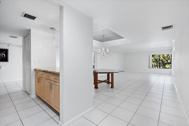 tiled dining space featuring a notable chandelier, a raised ceiling, crown molding, and wine cooler