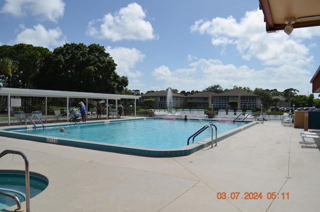 view of swimming pool with a patio