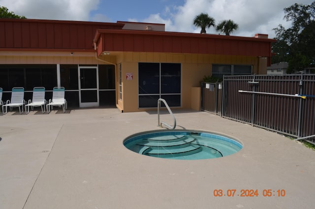 view of pool with a community hot tub and a patio