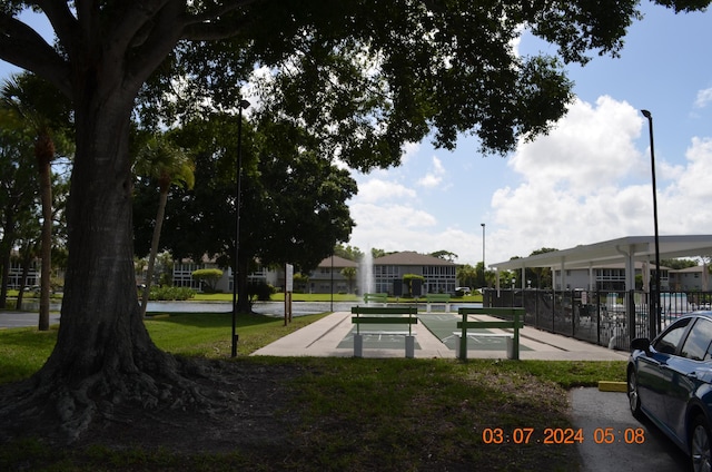 view of community featuring a lawn