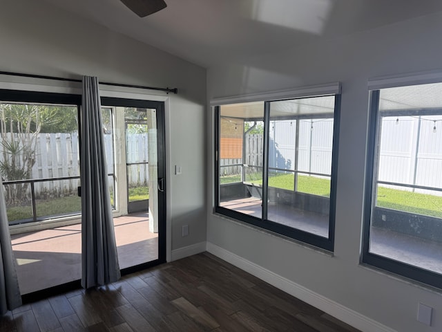 entryway featuring dark hardwood / wood-style floors and vaulted ceiling