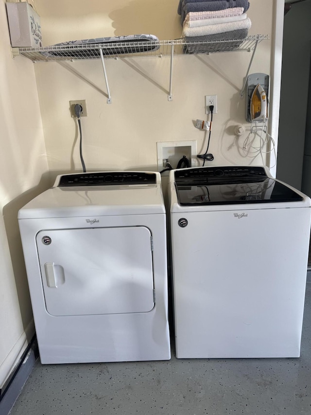 laundry area with independent washer and dryer