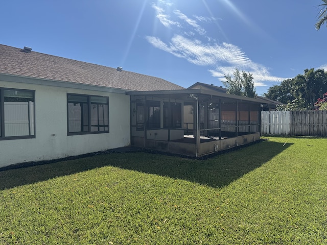 view of yard with a sunroom