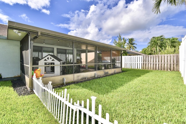 view of yard with a sunroom