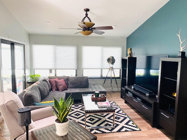 living room with light hardwood / wood-style floors and ceiling fan