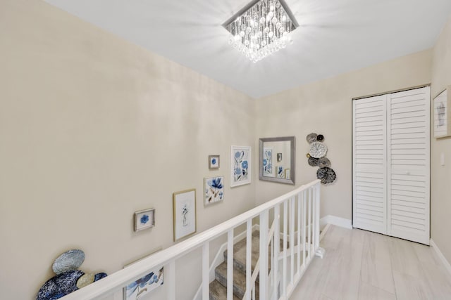 hallway with a chandelier