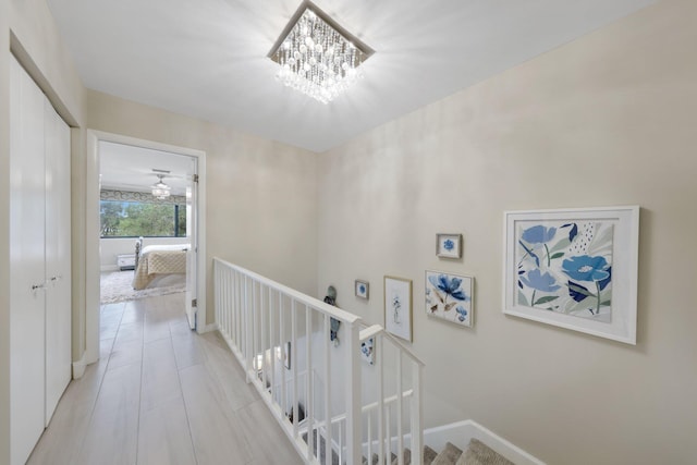 hallway featuring a chandelier