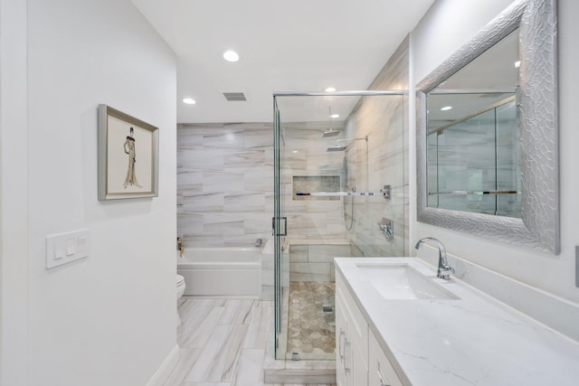 bathroom featuring vanity, toilet, and an enclosed shower