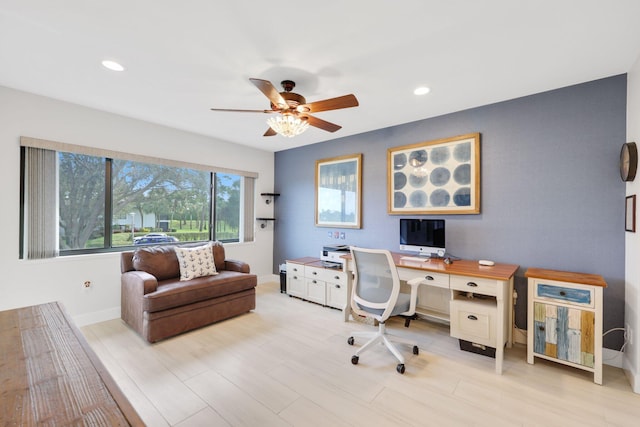 office featuring light hardwood / wood-style floors and ceiling fan